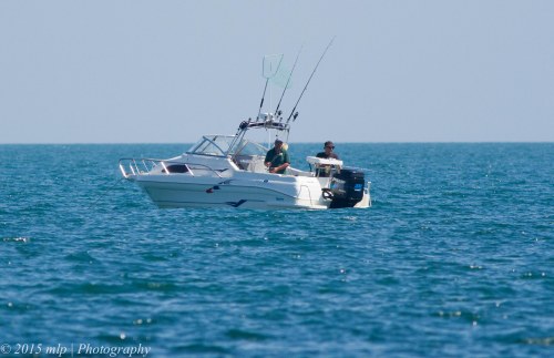 Fisherman in their boat off Ricketts Point
